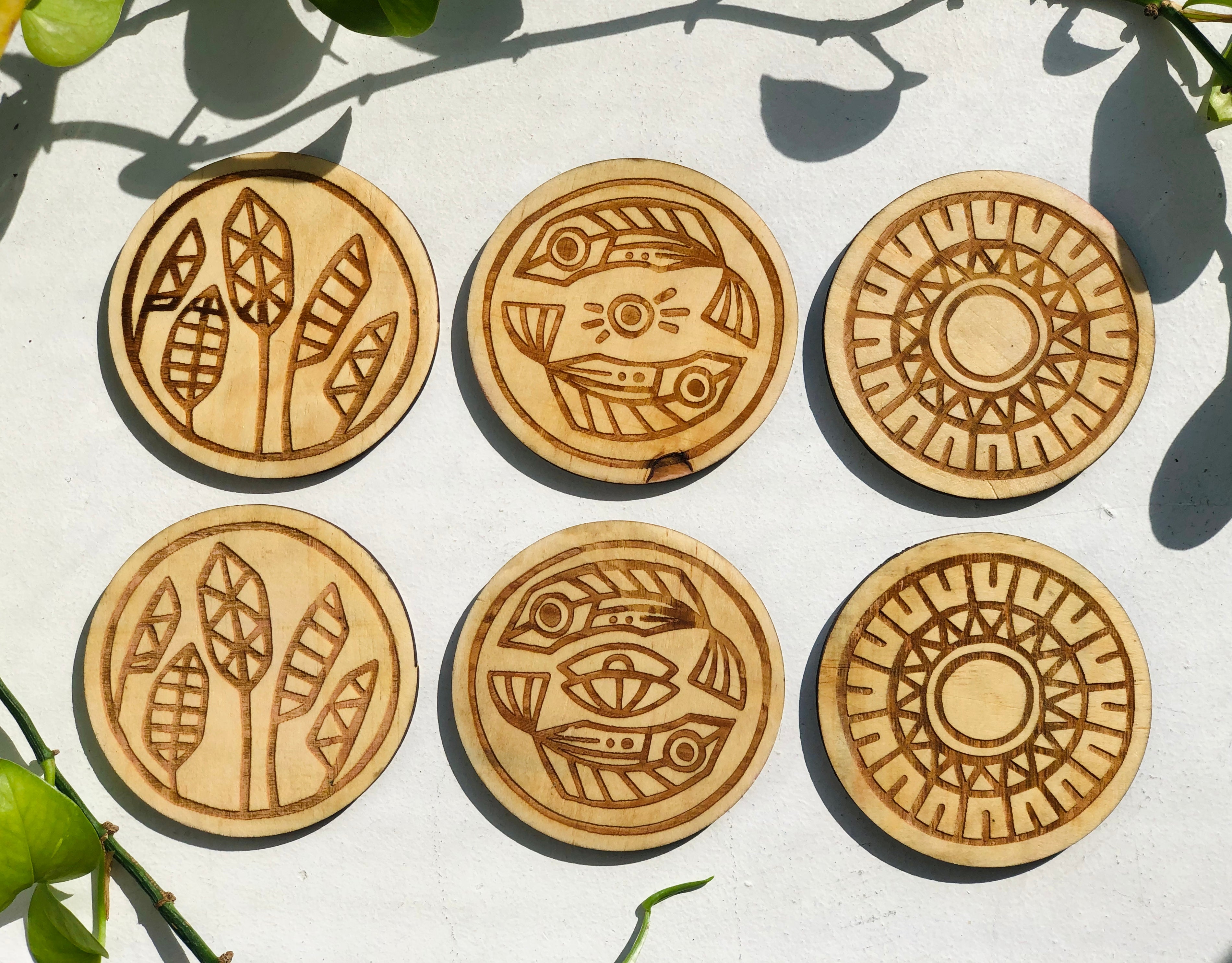 Display of 6pc carved wooden coaster set.