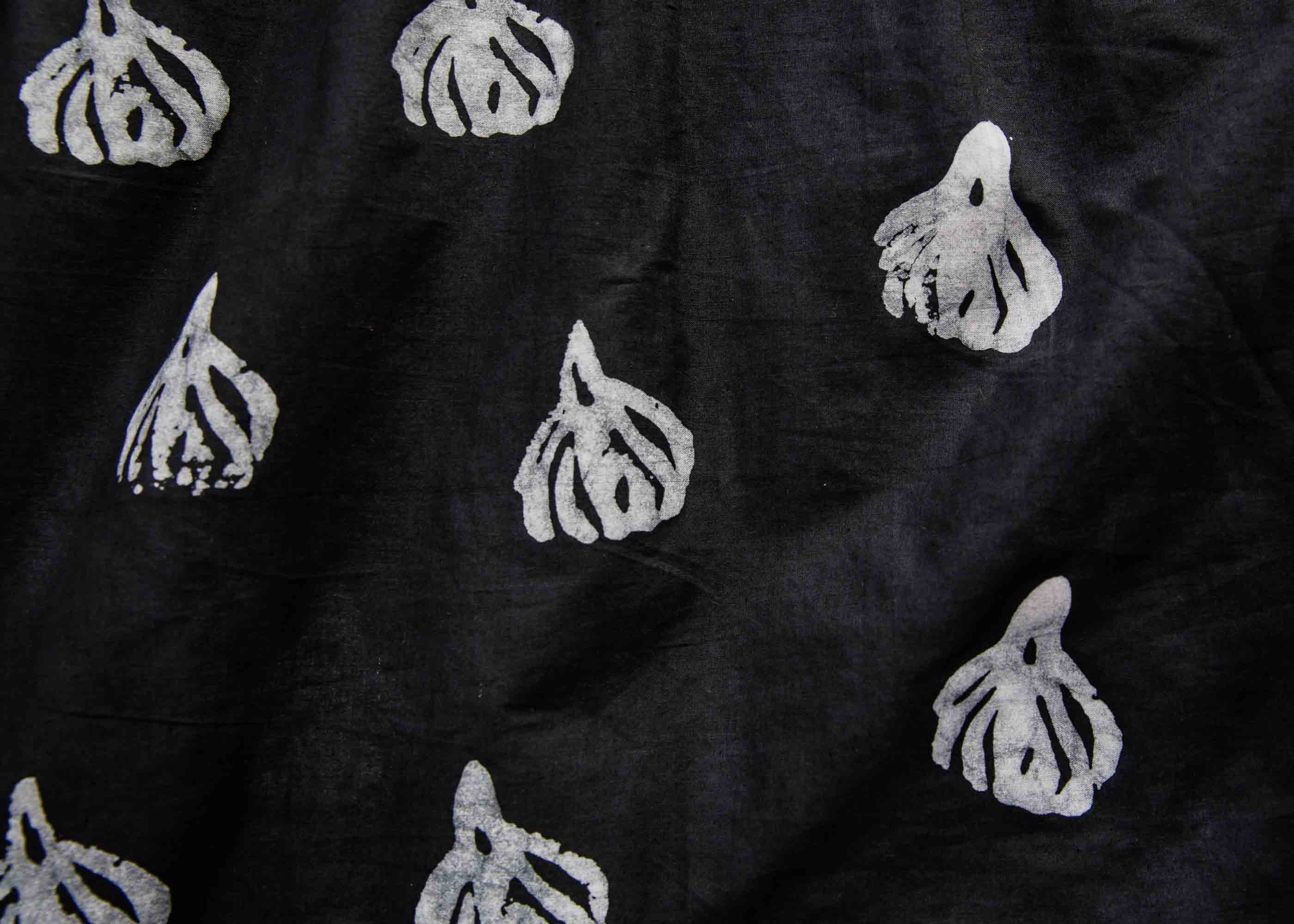 Display of a black and white garlic design shirt