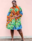 model wearing a rainbow swirl design dress
