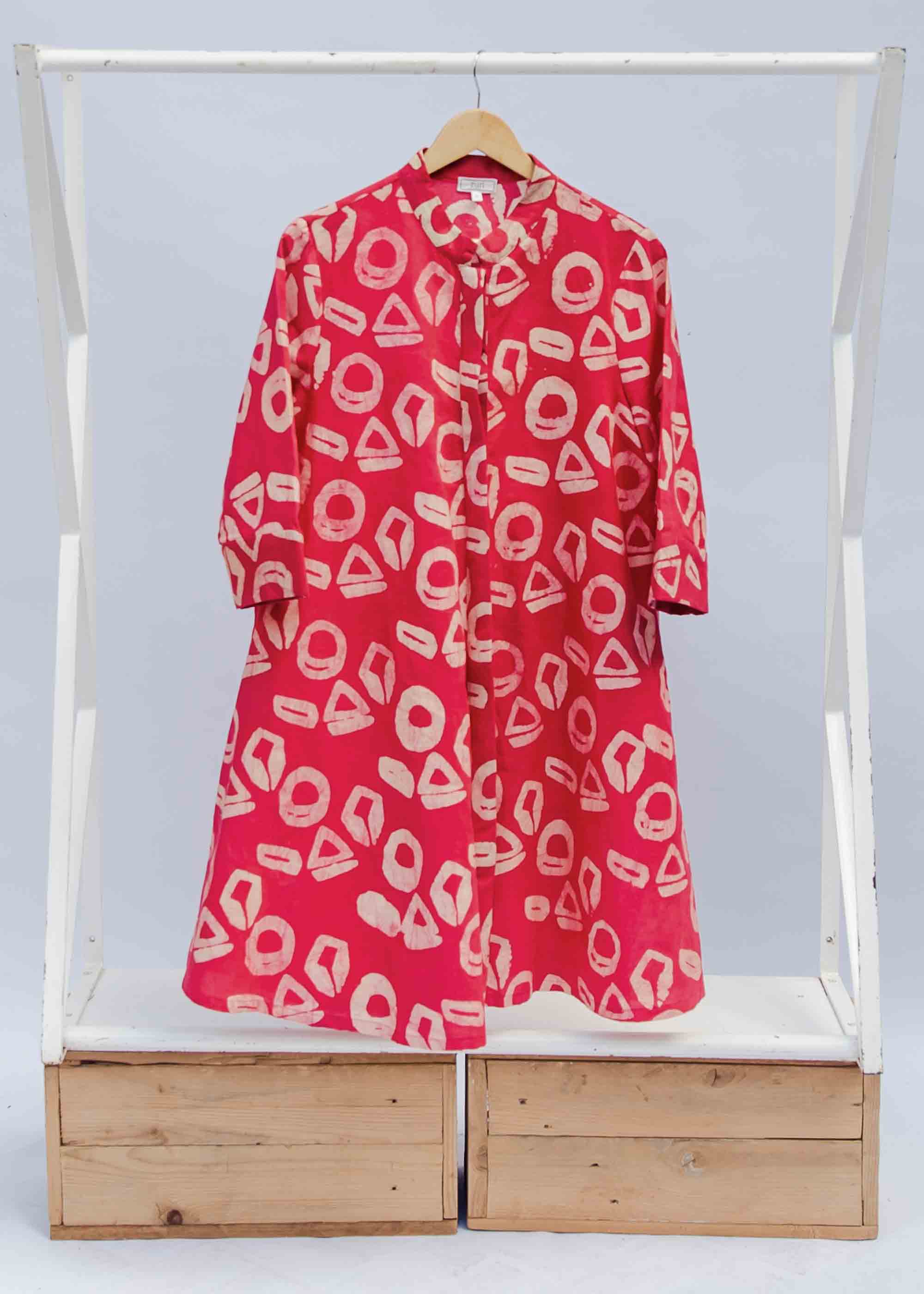 display of a pink and white geometric print dress