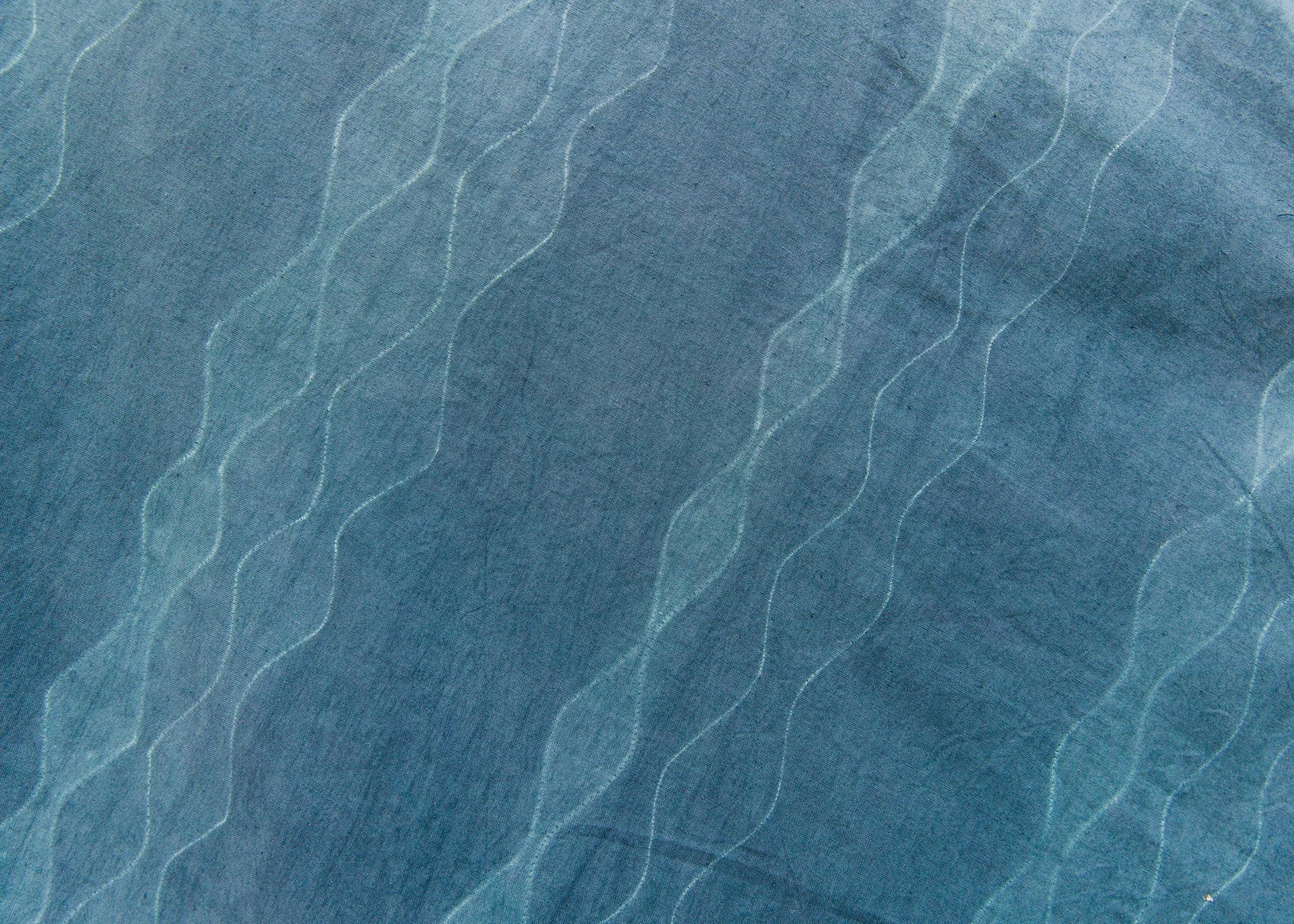 Stitch resist dyed fabric
