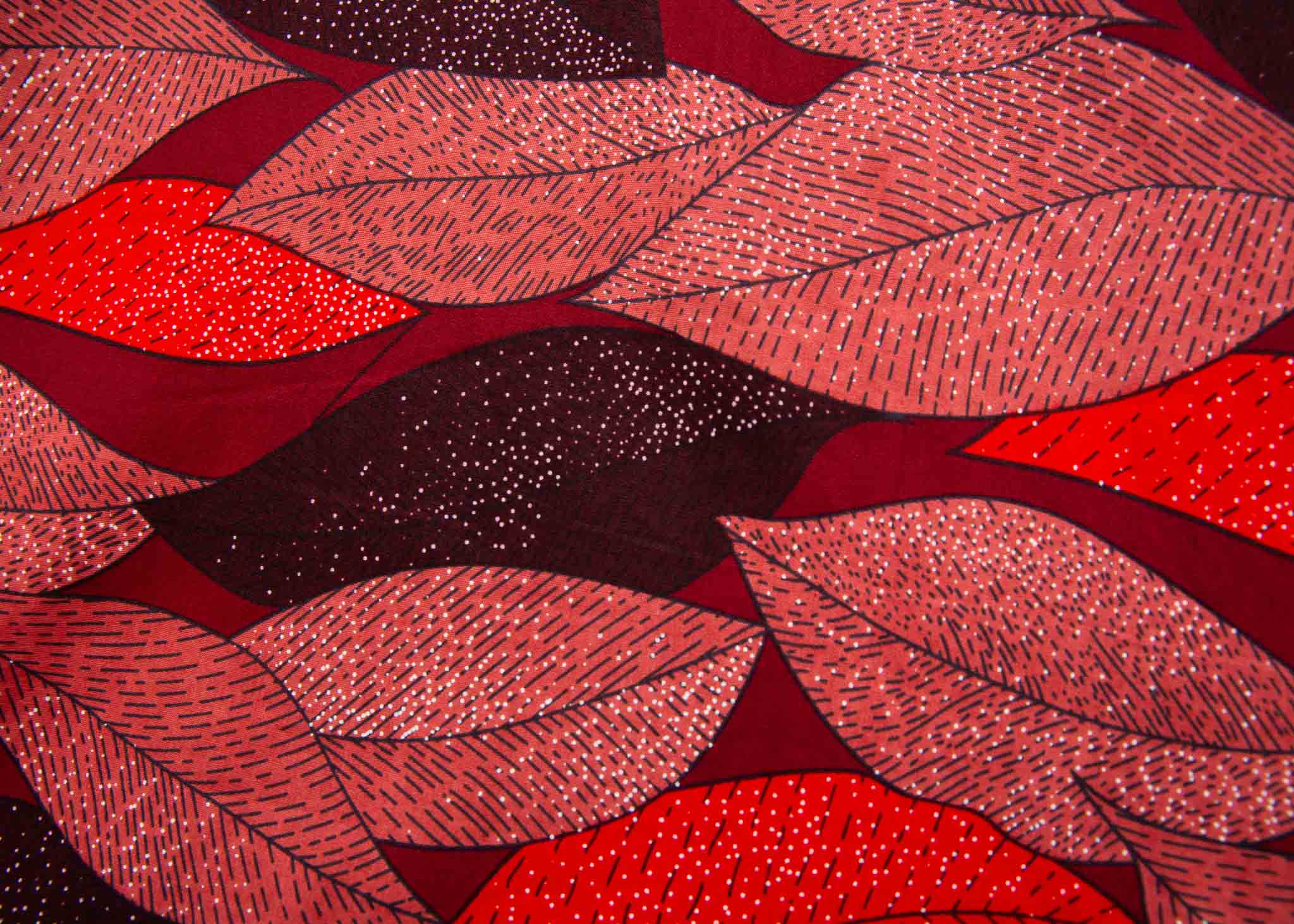 Display of red, brown, burgundy leaf print dress.