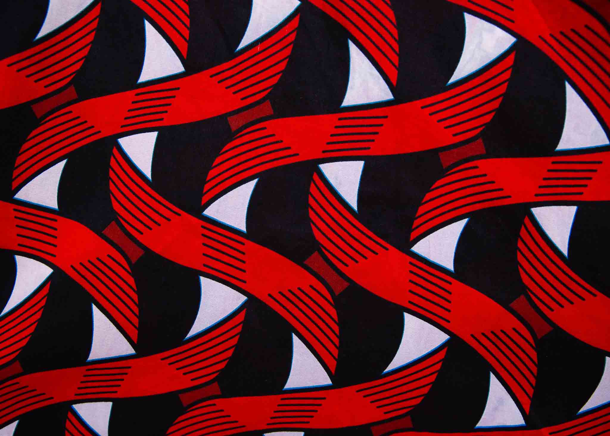 Display of red, black and white ribbon print dress.