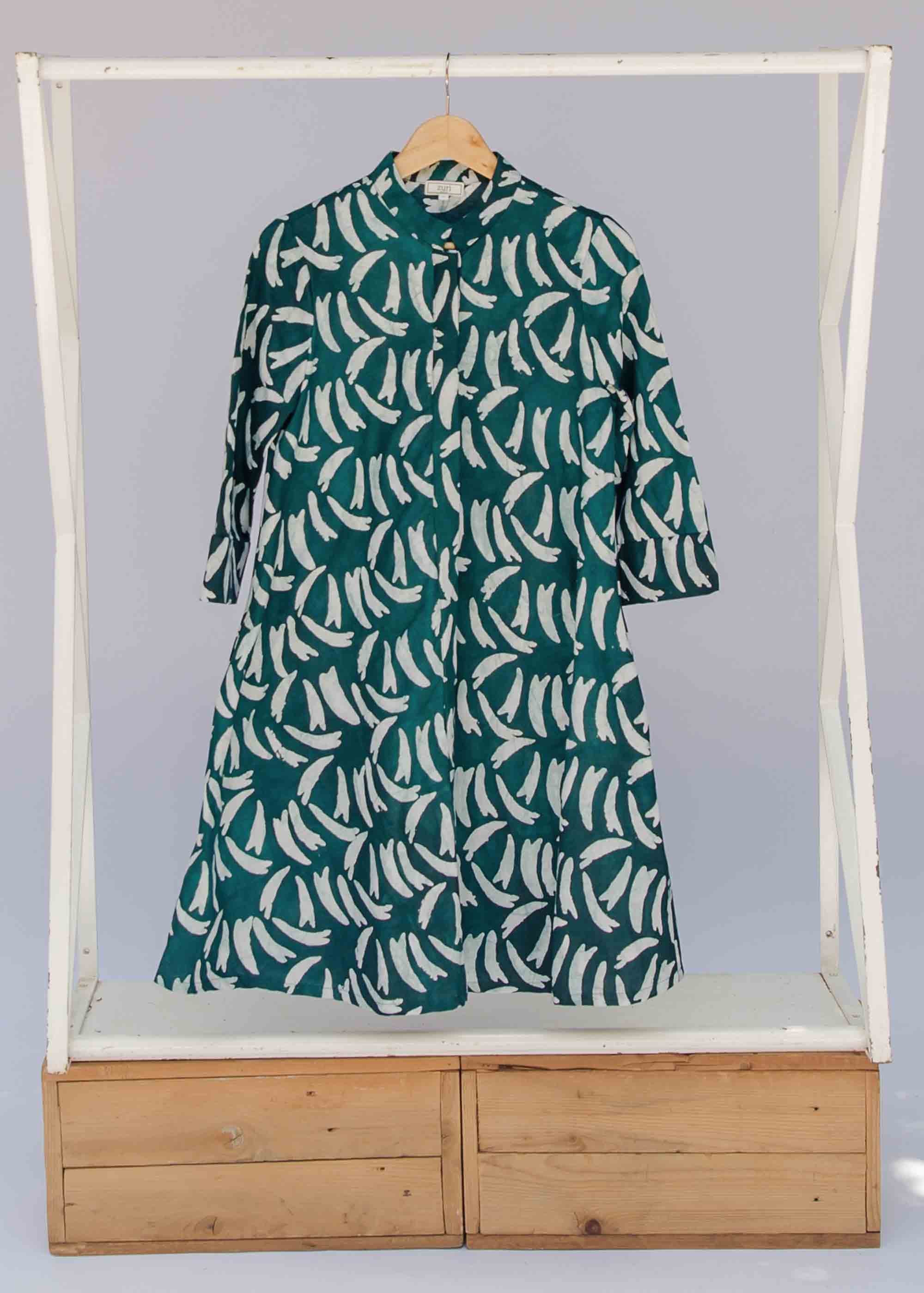 display of a green and white swoosh design dress