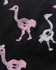 display of a black, white and pink ostrich design dress