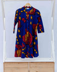 display of a rooster and chick design dress in blue, red and orange
