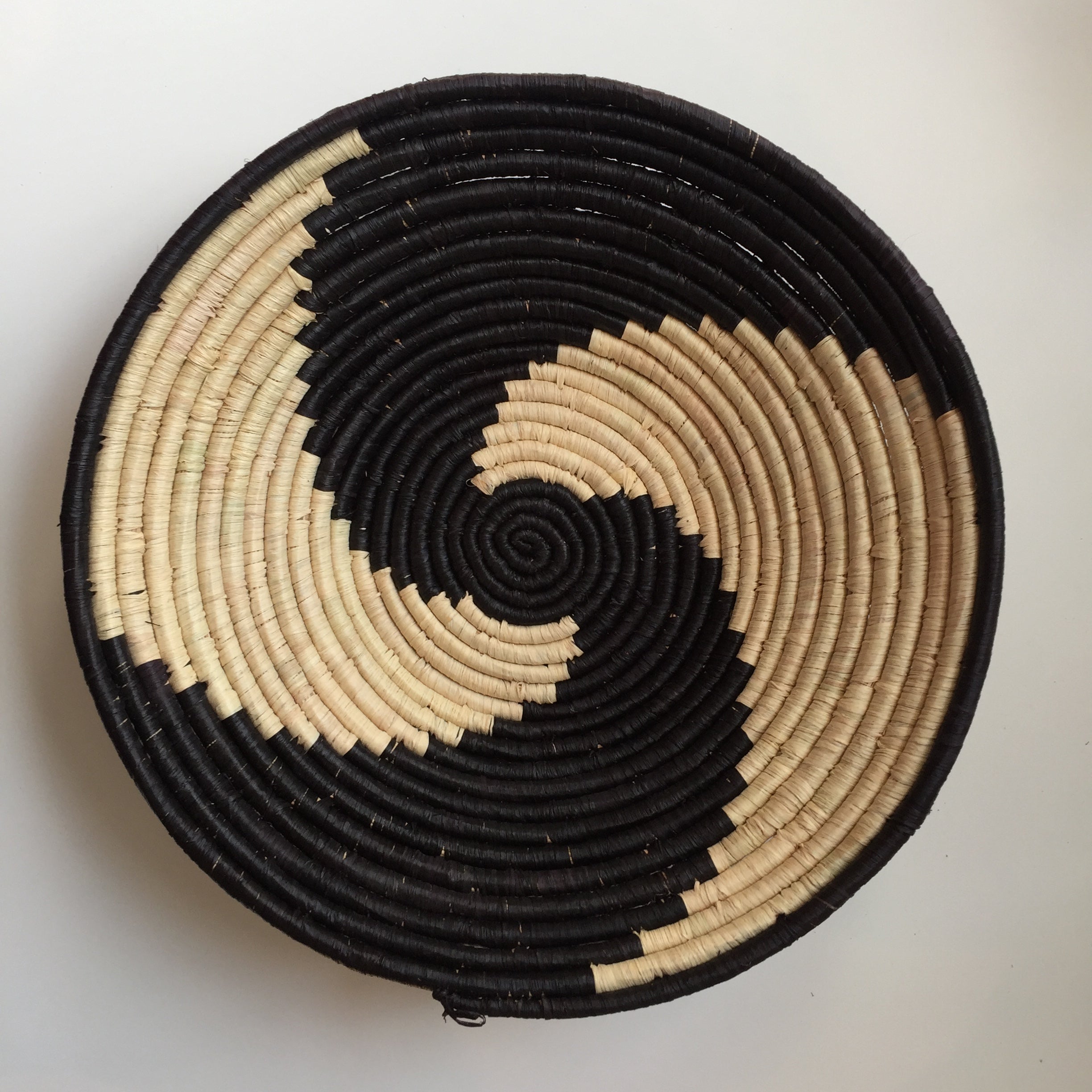 Black and natural pinwheel design woven bowl