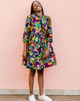 Model wearing rainbow floral print dress.