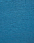 Close up of cerulean blue linen fabric.